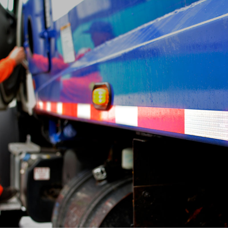 DOT-C2 conspicuity tape on a garbage truck